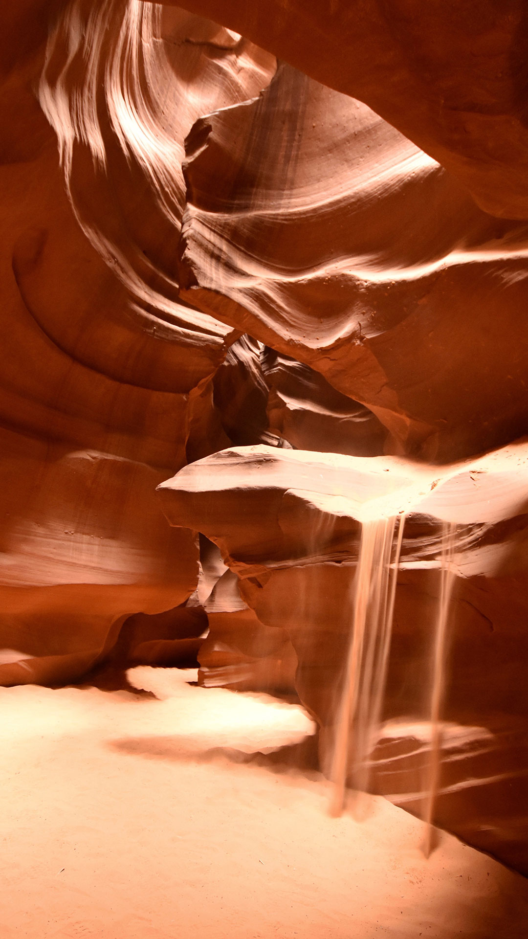 Sand Pouring Down A Cave relaxing wallpaper for iPhone